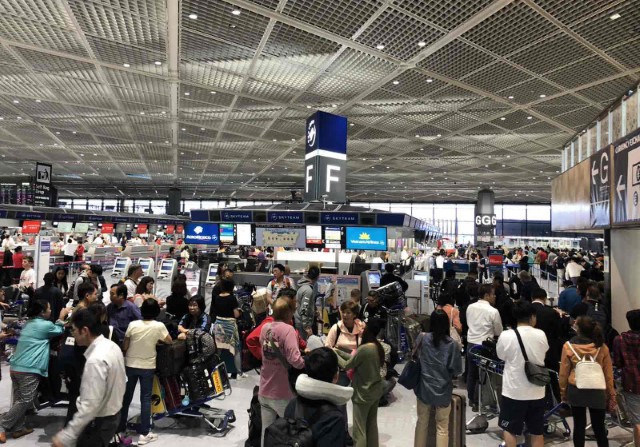 Narita Airport Staff Assists Passengers after Typhoon Hagibis